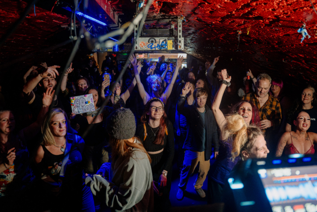 The audience dancing with their hands in the air at our first sober rave at Basement 45