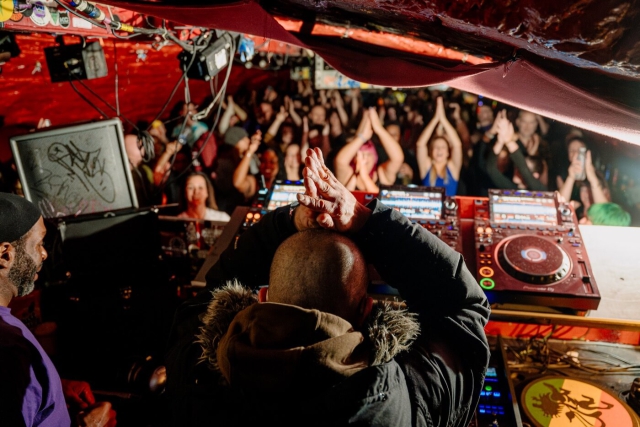 Nicky Blackmarket DJing at our first sober rave at Basement 45, getting the crowd to do the same shark pose