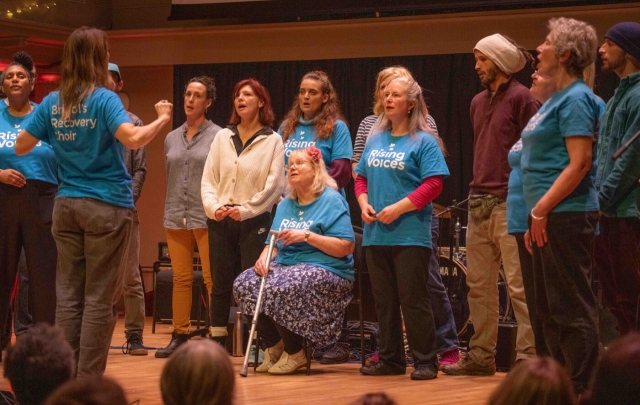 Rising Voices standing in a line performing at St George's for the High Sheriff concert in 2024
