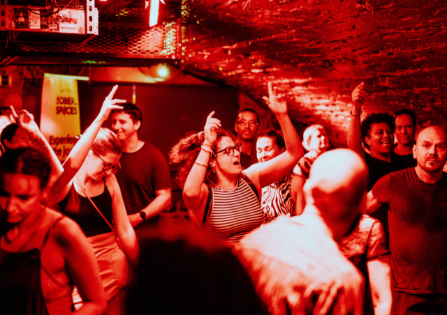 The audience dancing with their hands in the air at our first sober rave at Basement 45