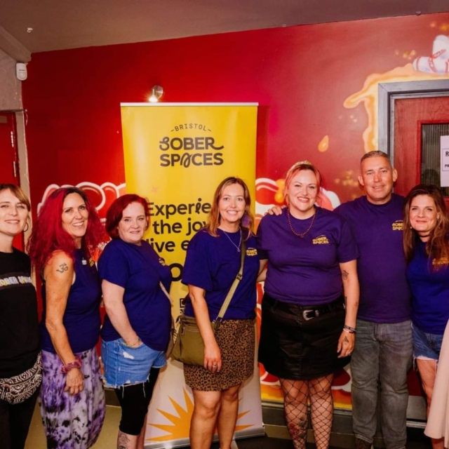 Bristol Sober Spaces volunteers stood together smiling for a photo at our sober rave at Basement 45