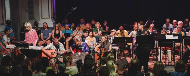 Trinity Move On music group on stage at the Creative Communities summer showcase 2024 at Bristol Beacon