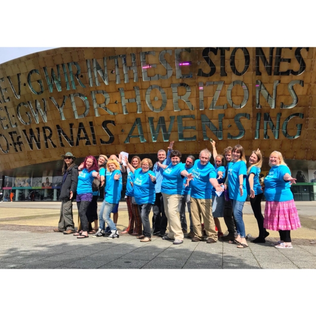 Rising Voices smiling standing outside Millennium Centre after their performance at the Festival of Voices in 2018