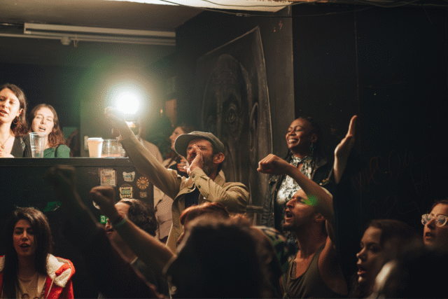 The crowd clapping and cheering at our sober hip hop night at Art Club