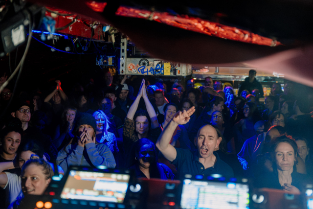 The audience dancing with their arms in the air at Bristol Sober Spaces' sober rave at Basement 45