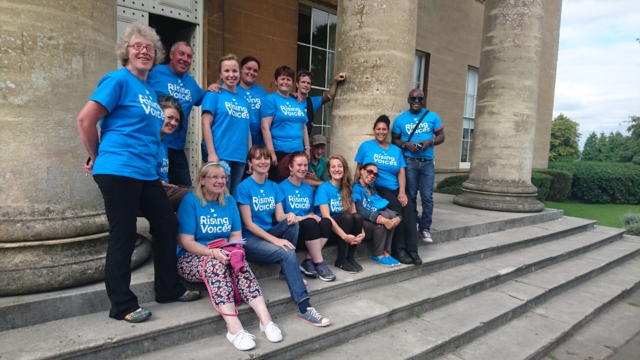 The choir standing outside Spire Hospital before a performance at the Bupa conference