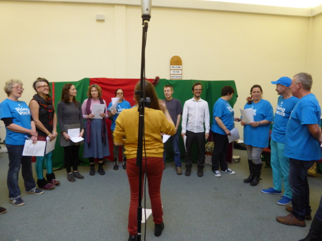 The choir standing in a semi-circle for the BBC filming, Christmas 2016