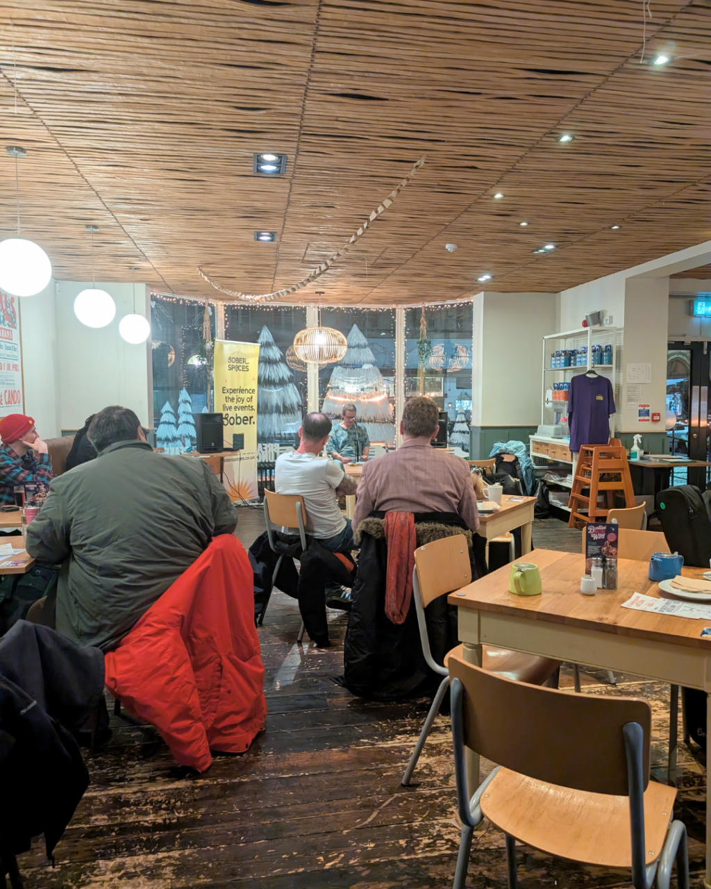 the audience sat watching spoken word at the Sober Open Mic at Boston Tea Party